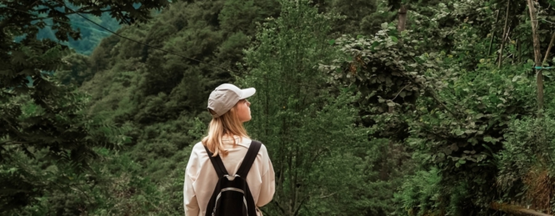 Woman walking through trail